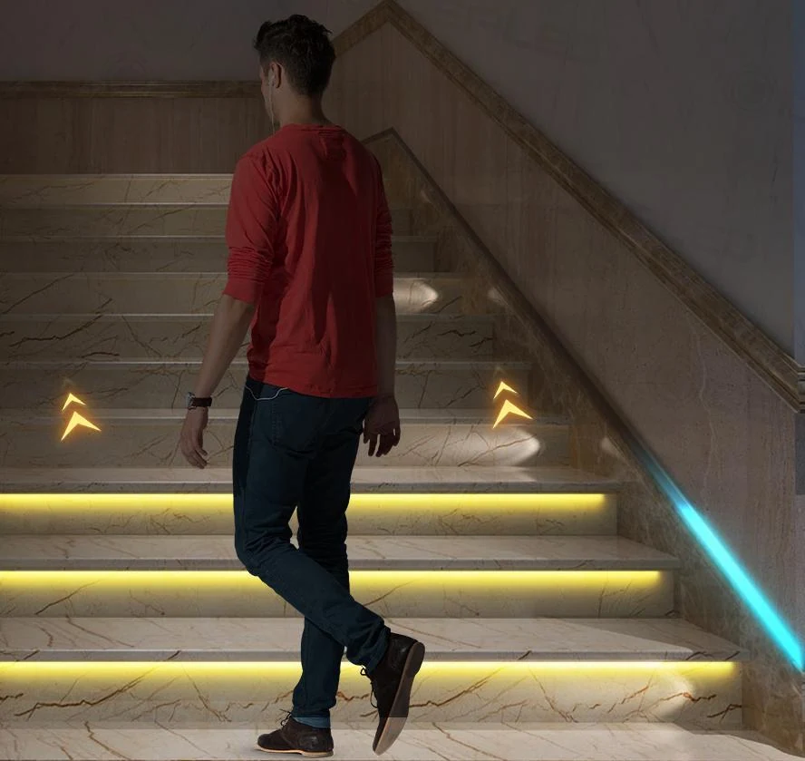 Staircase illuminated with individually controlled LED strip sections