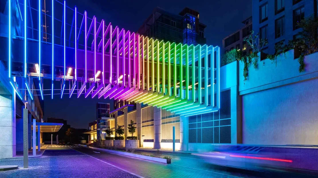 Blue architectural facade illuminated with linear LED light