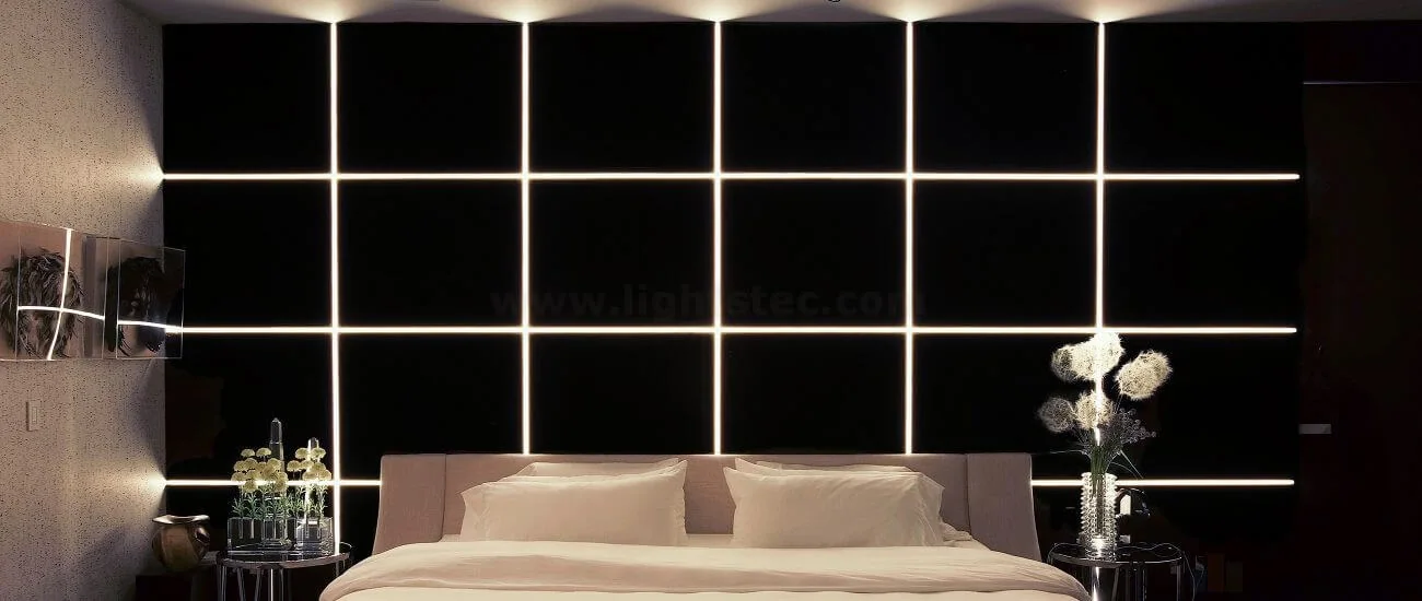 Warm linear LED lighting installed around a bedroom ceiling