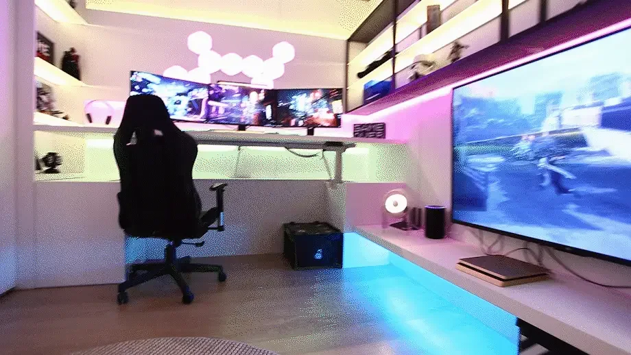 Gaming station with a strong blue wall wash behind the desk